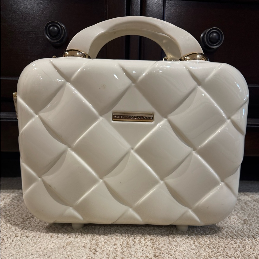 Marcy McKenna cream colored travel makeup-accessories case